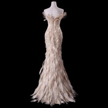 Load image into Gallery viewer, True Couture Plugging V neckline  Floor Length  Feather Champagne Evening Gown