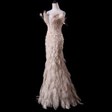 Load image into Gallery viewer, True Couture Plugging V neckline  Floor Length  Feather Champagne Evening Gown
